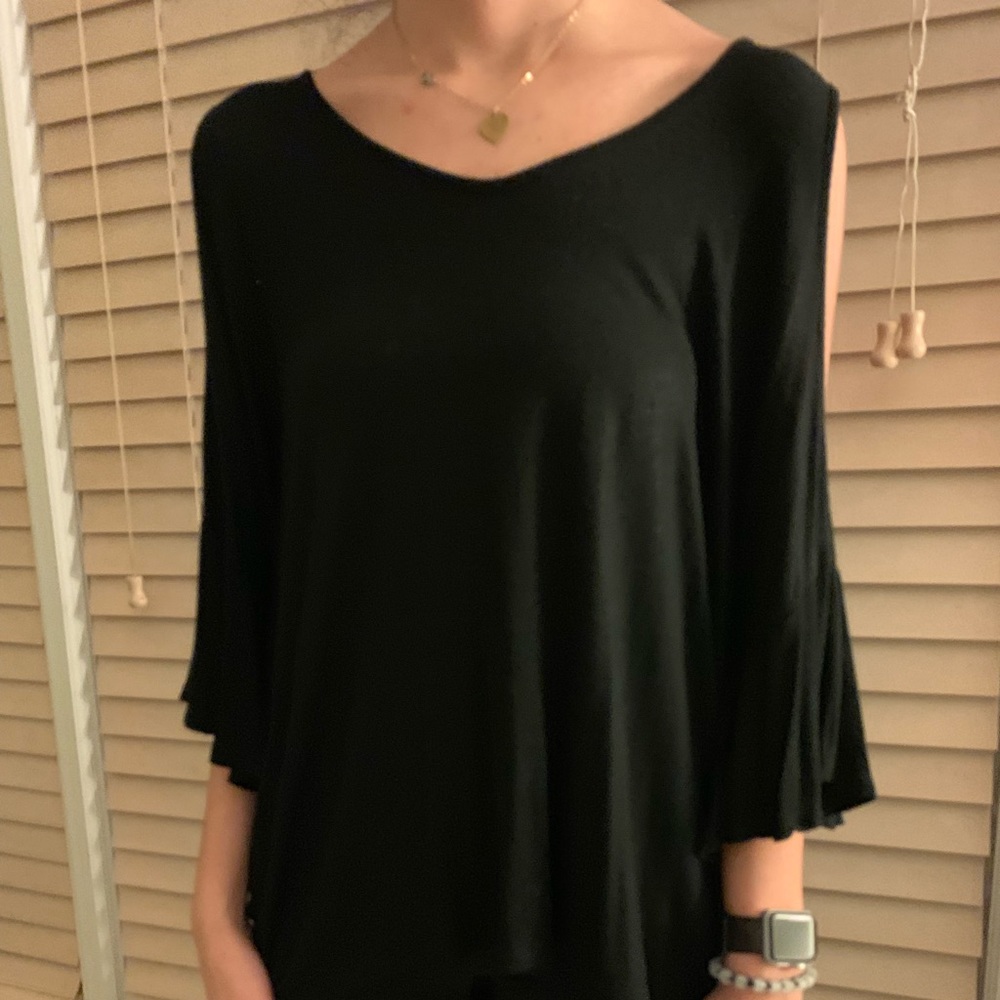 Black top with open arm